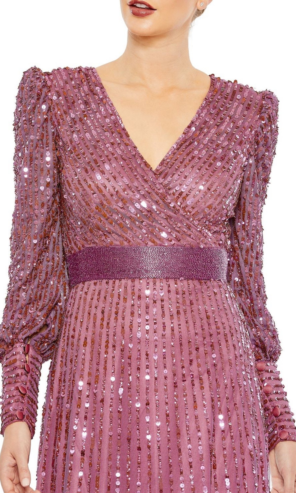 Woman wearing the Mac Duggal 5720 long sleeve sequin formal dress in mauve, featuring a V-neckline and textured waistband—an elegant choice for evening events or as a mother of the bride. Shown from shoulders to mid-thigh.